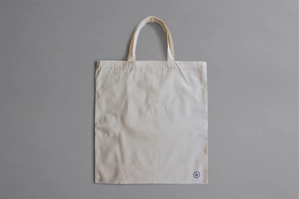 A canvas market bag with long handles; illustrative product photograph